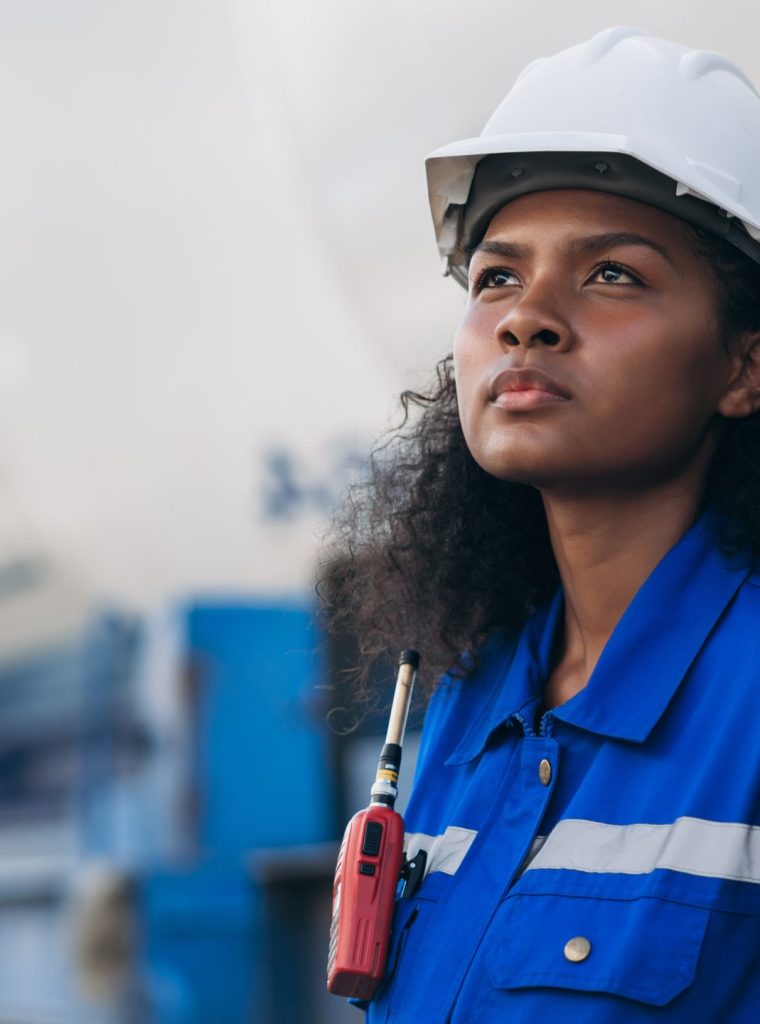 Engineer conducting outdoor railway inspection for natural gas transport and industrial freight logistics.